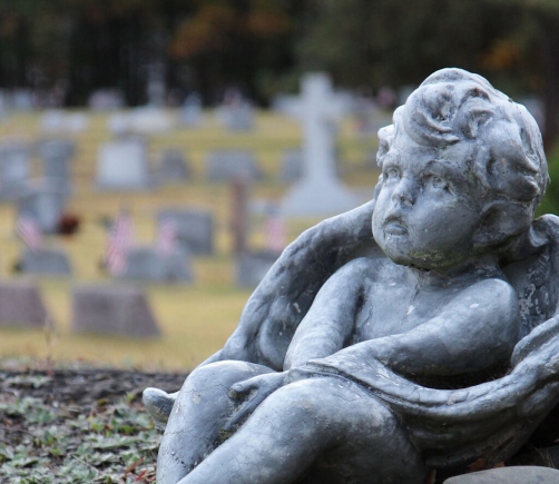 A cherub statue at pine grove cemetery